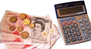 Calculator and coins representing savings on booking fees
