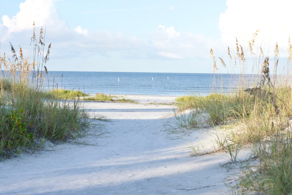 Sandy path through sea oats leading to the Gulf of Mexico at Fort Myers Beach