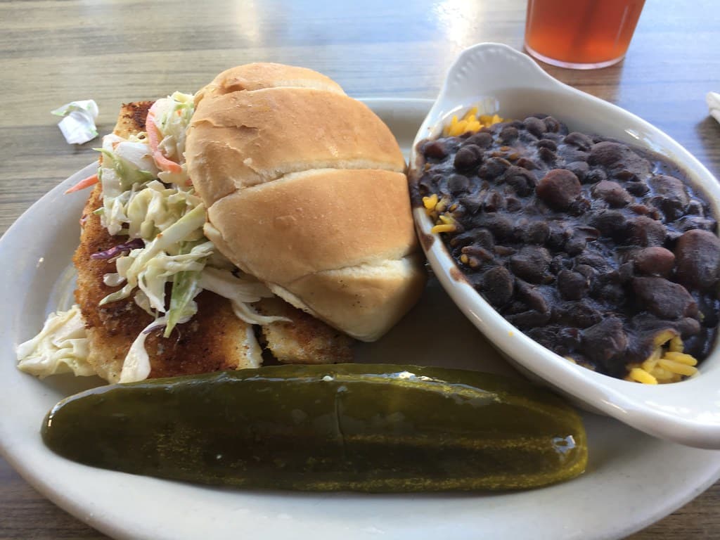 Fried fish sandwich with black beans and rice served at Doc Ford's