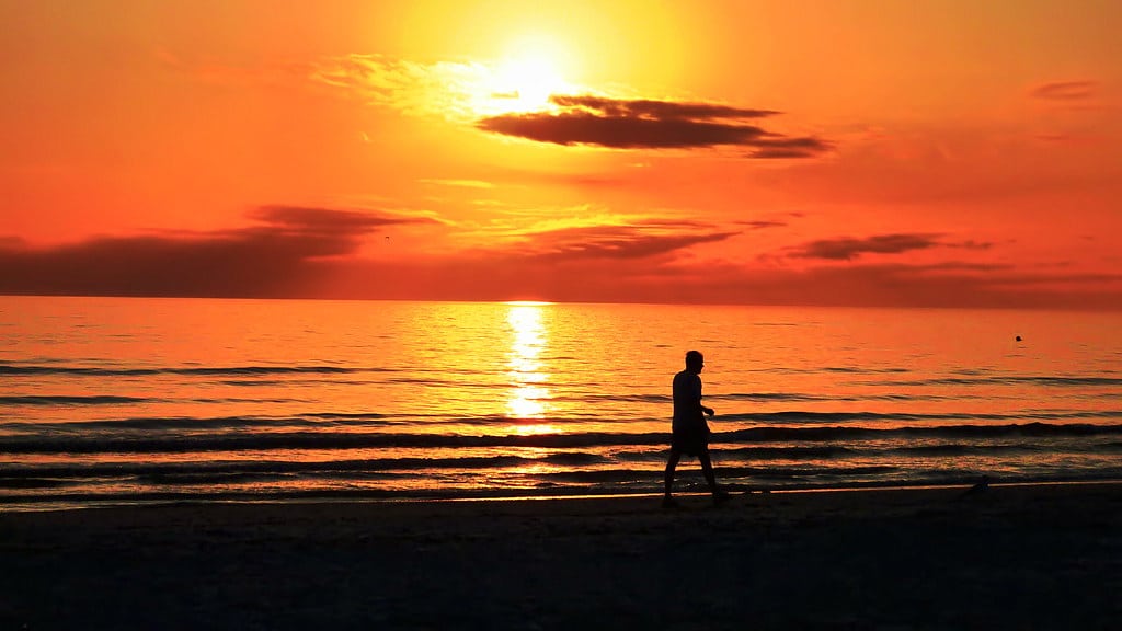 Blazing orange sunset over the Gulf of Mexico seen from Fort Myers Beach